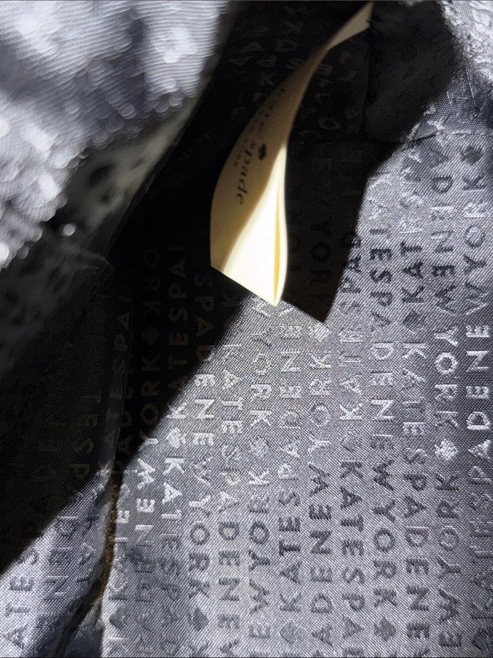 Kate Spade Grove Street Carli Satchel features a classic look